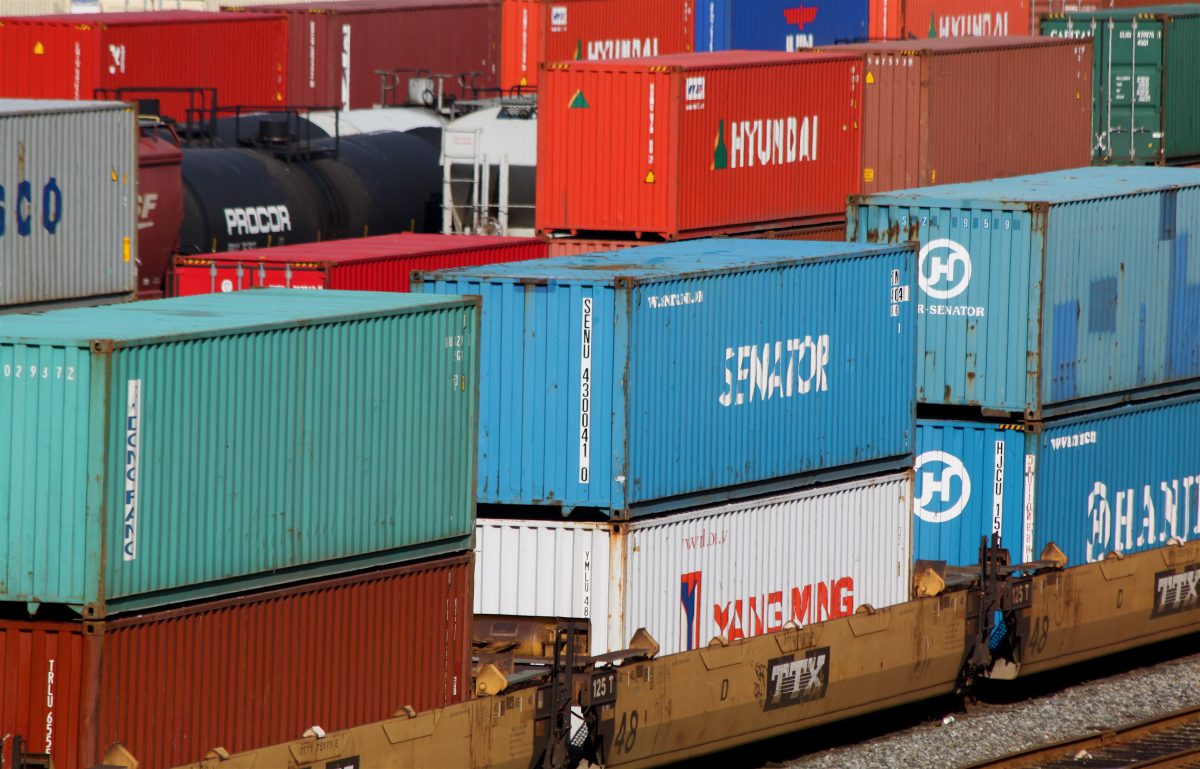 Cargo containers stacked at a shipping port representing US trade flows