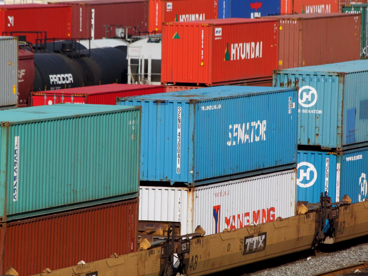 Cargo containers stacked at a shipping port representing US trade flows