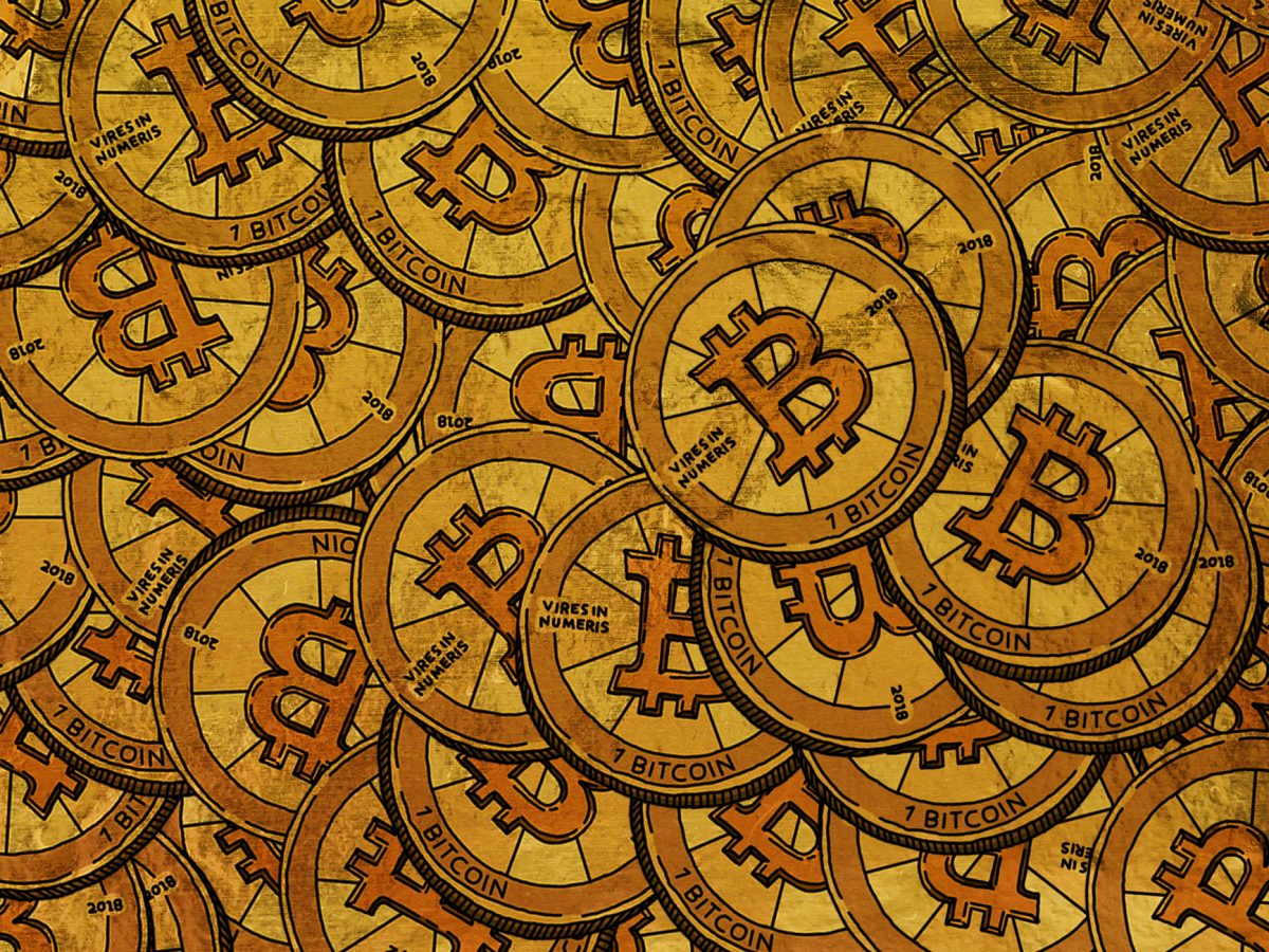 Bitcoin and cryptocurrency coins on dark background