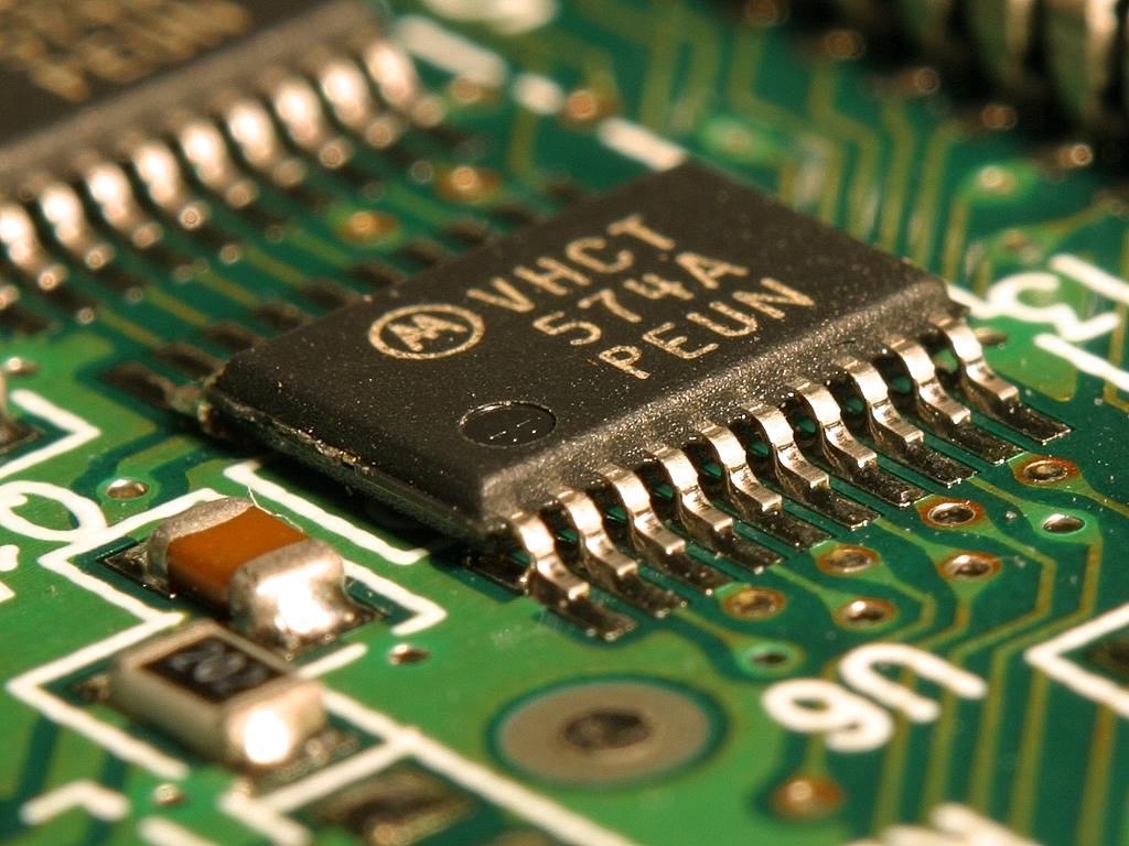 Close-up of an integrated circuit microchip, at the centre of US debate over expanded semiconductor tariffs