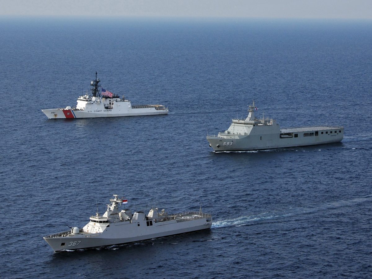 Indonesian and U.S. Coast Guard ships transiting the Java Sea during exercises